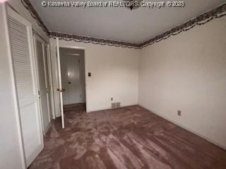873 Woods Dr, Saint Albans, WV 25177 - unfurnished bedroom with carpet floors