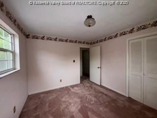 873 Woods Dr, Saint Albans, WV 25177 - unfurnished bedroom featuring a closet and carpet