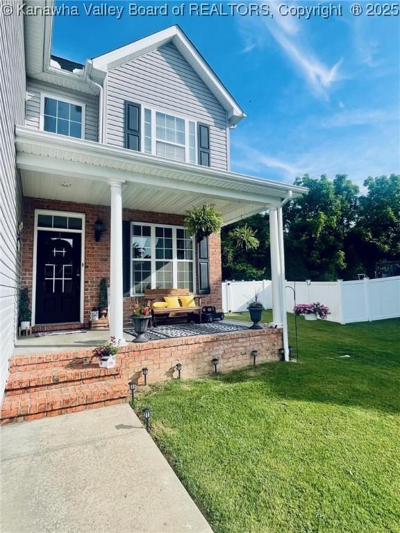 4052 Farmington Dr, Hurricane, WV 25526 - view of front facade featuring covered porch and brick siding