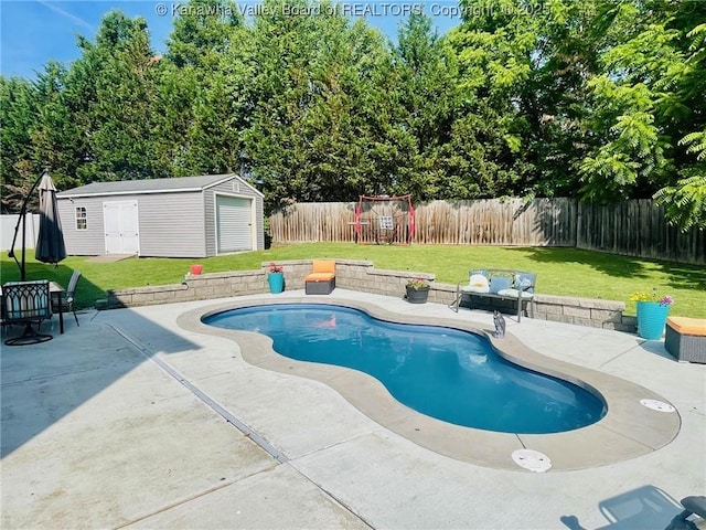 4052 Farmington Dr, Hurricane, WV 25526 - view of swimming pool with a fenced backyard, a patio area, and an outbuilding