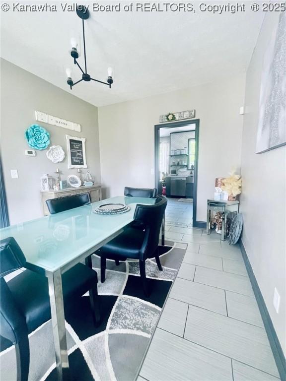 4052 Farmington Dr, Hurricane, WV 25526 - dining space featuring a chandelier and tile patterned floors