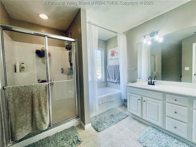 4052 Farmington Dr, Hurricane, WV 25526 - bathroom with vanity, a bath, and a stall shower