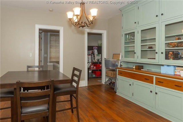 1212 10th St, Huntington, WV 25701 - dining space with a chandelier and dark wood-type flooring