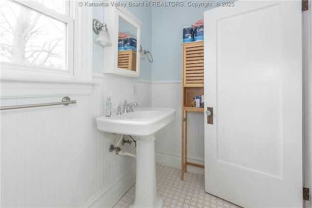 1212 10th St, Huntington, WV 25701 - bathroom with a wainscoted wall and a sink