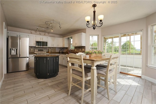 18 Long St, Winfield, WV 25213 - dining space with light wood finished floors and a chandelier