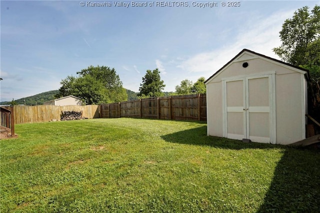 18 Long St, Winfield, WV 25213 - fenced backyard with a storage shed