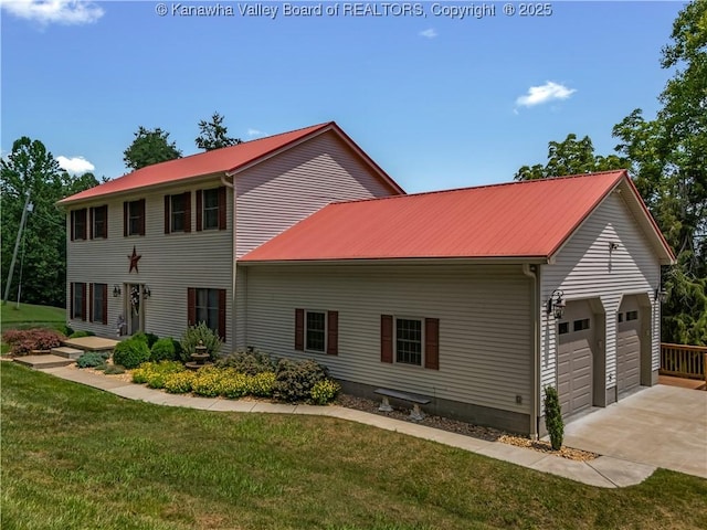 1437 Statts Mills Rd, Ripley, WV 25271 - view of front of house with a metal roof, concrete driveway, a garage, and a front yard
