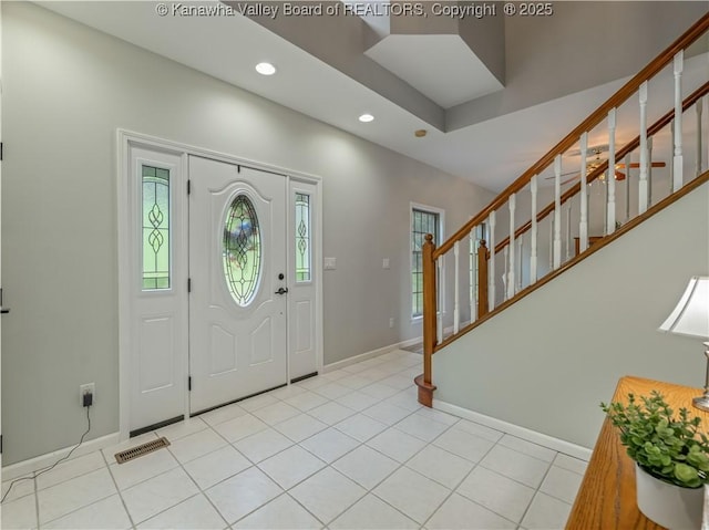 1437 Statts Mills Rd, Ripley, WV 25271 - foyer entrance with healthy amount of natural light, stairway, recessed lighting, and light tile patterned floors
