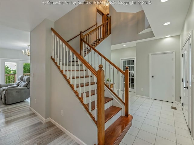 1437 Statts Mills Rd, Ripley, WV 25271 - stairs featuring a chandelier, recessed lighting, and wood finished floors