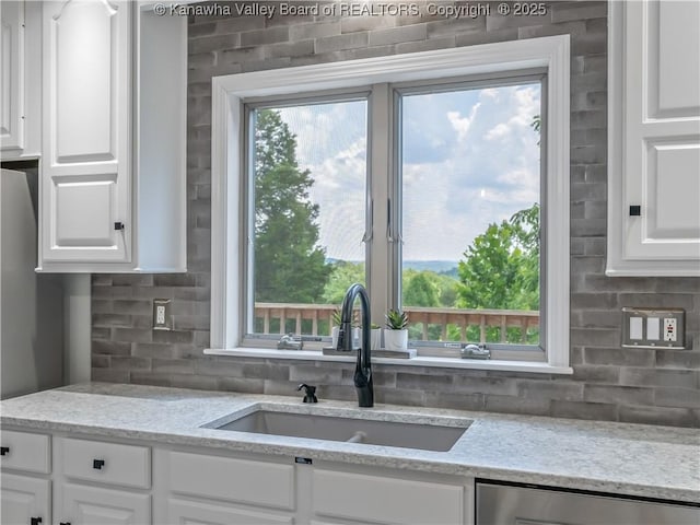 1437 Statts Mills Rd, Ripley, WV 25271 - kitchen featuring white cabinets, dishwasher, backsplash, and light stone countertops