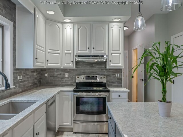 1437 Statts Mills Rd, Ripley, WV 25271 - kitchen with appliances with stainless steel finishes, under cabinet range hood, white cabinetry, and recessed lighting