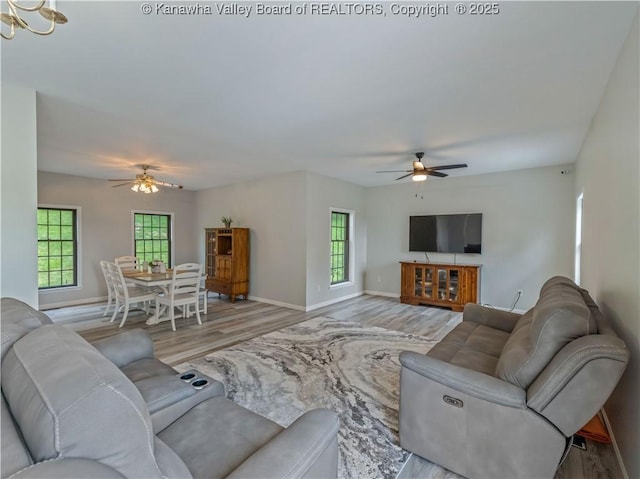 1437 Statts Mills Rd, Ripley, WV 25271 - living area featuring ceiling fan, wood finished floors, and plenty of natural light
