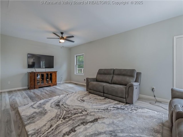 1437 Statts Mills Rd, Ripley, WV 25271 - living room featuring ceiling fan and light wood-type flooring