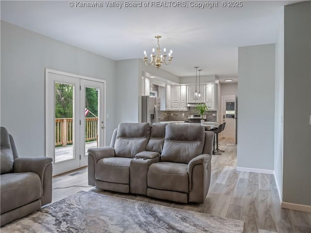 1437 Statts Mills Rd, Ripley, WV 25271 - living area featuring a chandelier and light wood finished floors