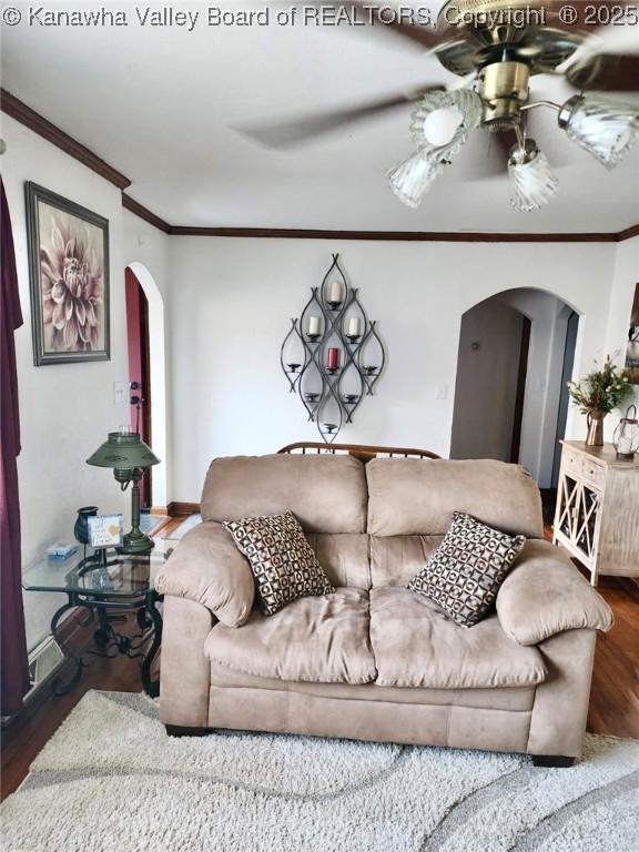 105 Franklin Ave, Saint Albans, WV 25177 - living area featuring arched walkways, wood finished floors, ceiling fan, and crown molding