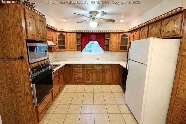 105 Franklin Ave, Saint Albans, WV 25177 - kitchen with black appliances, extractor fan, brown cabinets, and open shelves