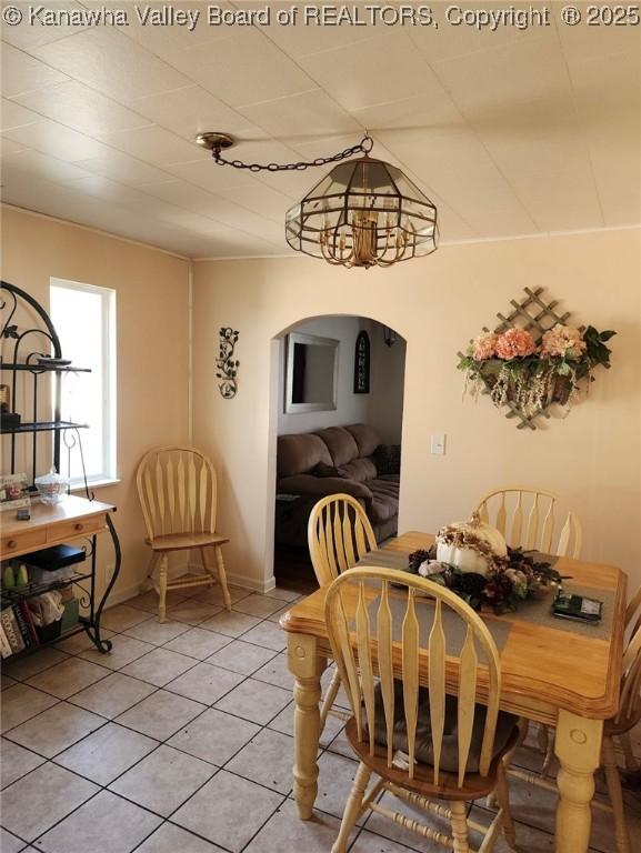 105 Franklin Ave, Saint Albans, WV 25177 - dining area with arched walkways and light tile patterned flooring