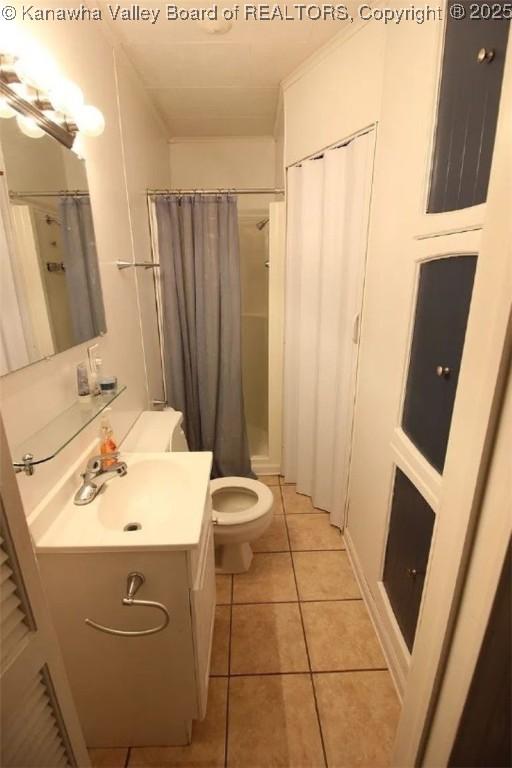105 Franklin Ave, Saint Albans, WV 25177 - bathroom featuring vanity, tile patterned floors, and a shower with shower curtain