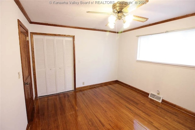105 Franklin Ave, Saint Albans, WV 25177 - unfurnished bedroom featuring a closet, wood finished floors, and a ceiling fan