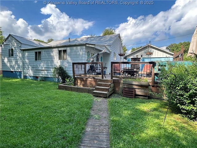 105 Franklin Ave, Saint Albans, WV 25177 - rear view of property with a metal roof, a deck, and a lawn