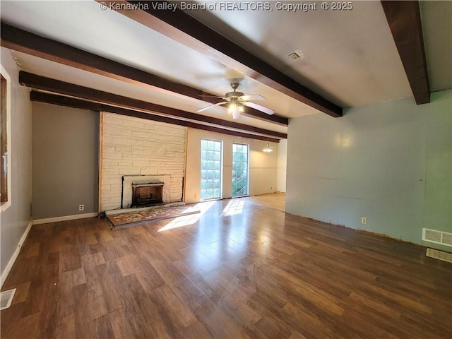 807 Honeysuckle Rd, Elkview, WV 25071 - unfurnished living room featuring beamed ceiling, wood finished floors, a stone fireplace, and a ceiling fan