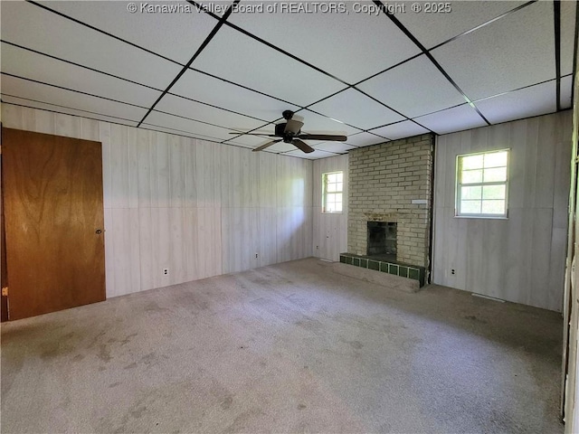 807 Honeysuckle Rd, Elkview, WV 25071 - unfurnished living room featuring a ceiling fan, a paneled ceiling, carpet flooring, plenty of natural light, and a fireplace