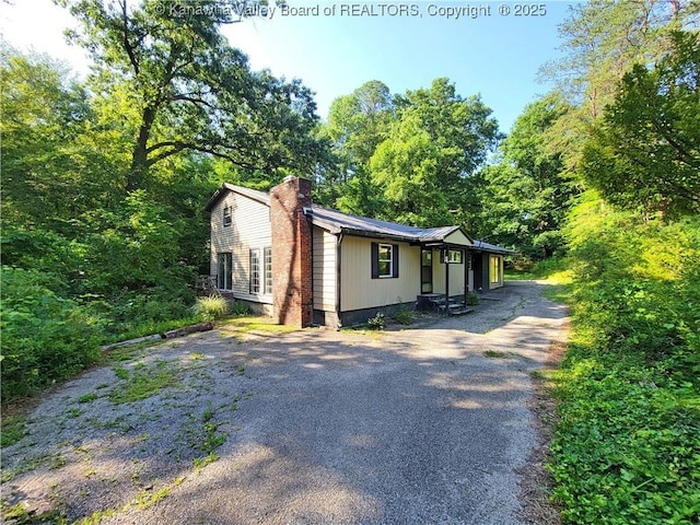 807 Honeysuckle Rd, Elkview, WV 25071 - view of front of house with driveway and a chimney