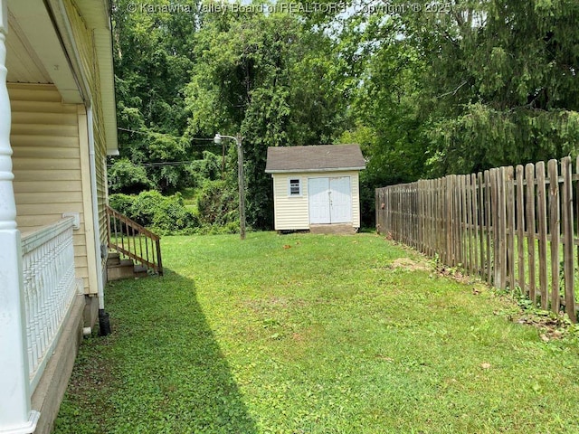 134 Ferguson Ct, Huntington, WV 25701 - view of yard with a storage unit and stairs