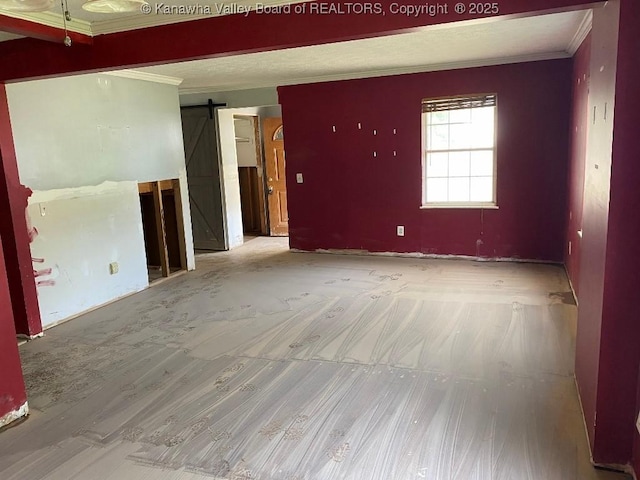 134 Ferguson Ct, Huntington, WV 25701 - spare room featuring a barn door, crown molding, and wood finished floors