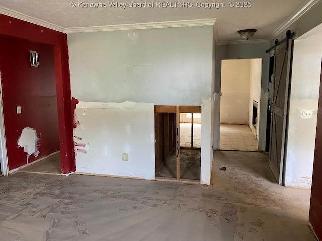 134 Ferguson Ct, Huntington, WV 25701 - empty room featuring a barn door, crown molding, and a textured ceiling