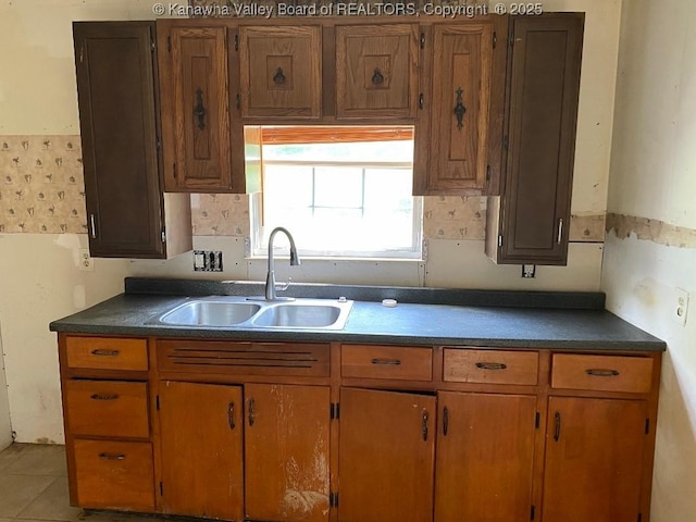 134 Ferguson Ct, Huntington, WV 25701 - kitchen featuring dark countertops and brown cabinets