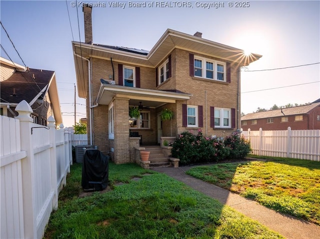 2961 Staunton Rd, Huntington, WV 25702 - view of front of property featuring a chimney, brick siding, covered porch, and ceiling fan
