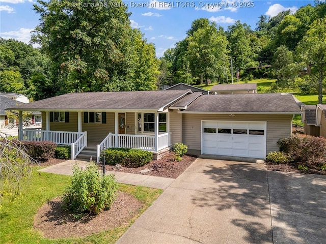 33 Shawnee Oaks Dr, Huntington, WV 25705 - ranch-style house with covered porch, an attached garage, driveway, and roof with shingles