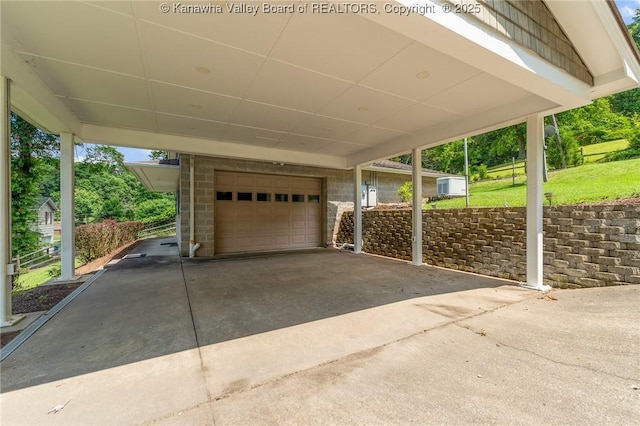 33 Shawnee Oaks Dr, Huntington, WV 25705 - garage with a carport and driveway