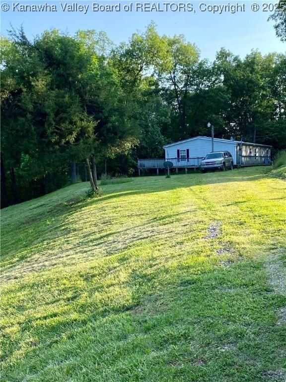 2399 Spicewood Rd, Kenna, WV 25248 - view of green lawn featuring a deck