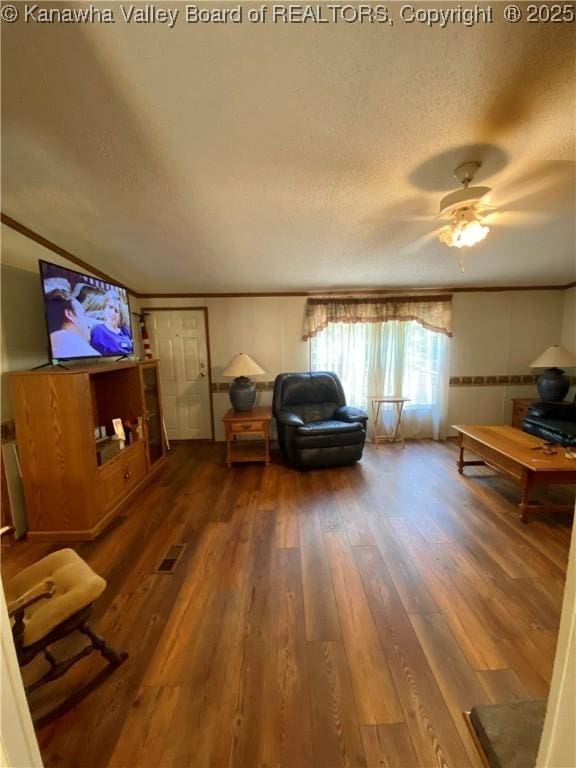 2399 Spicewood Rd, Kenna, WV 25248 - living room featuring hardwood / wood-style floors, a textured ceiling, ornamental molding, and a ceiling fan