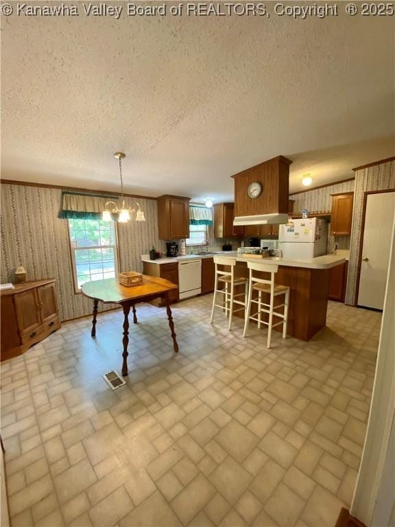 2399 Spicewood Rd, Kenna, WV 25248 - dining area featuring brick patterned floors, healthy amount of natural light, wallpapered walls, a textured ceiling, and a chandelier