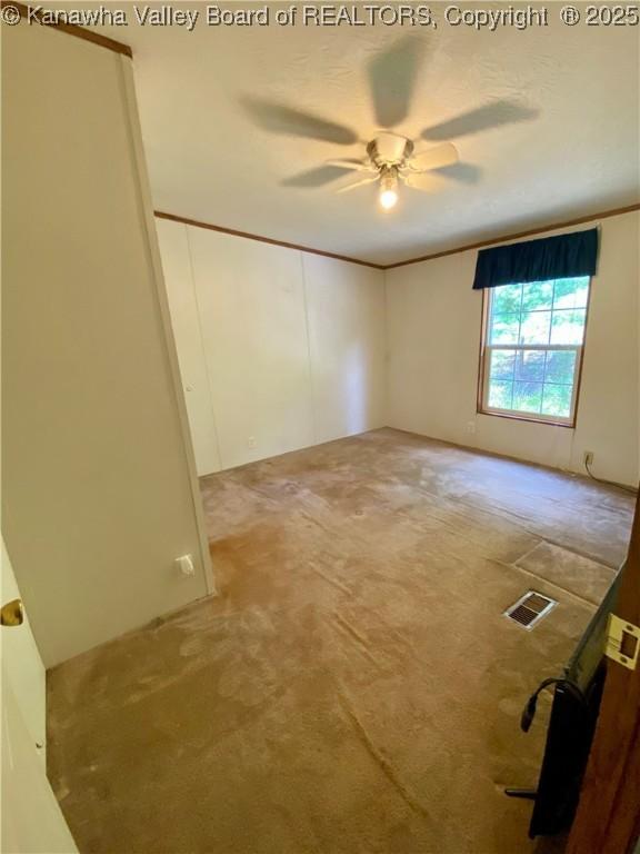2399 Spicewood Rd, Kenna, WV 25248 - spare room featuring carpet floors and ceiling fan
