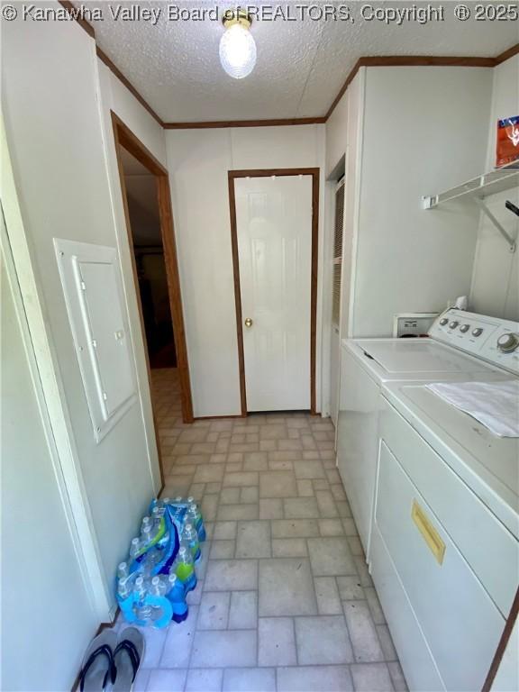 2399 Spicewood Rd, Kenna, WV 25248 - laundry area featuring washing machine and dryer, brick patterned floors, and a textured ceiling