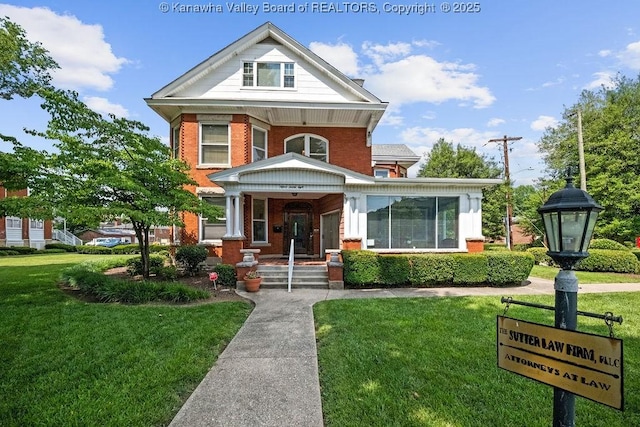 1598 Kanawha Blvd E, Charleston, WV 25311 - view of front facade with brick siding, covered porch, and a front lawn