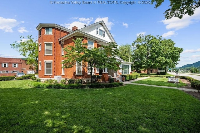 1598 Kanawha Blvd E, Charleston, WV 25311 - view of front of home with a front lawn, a chimney, and brick siding