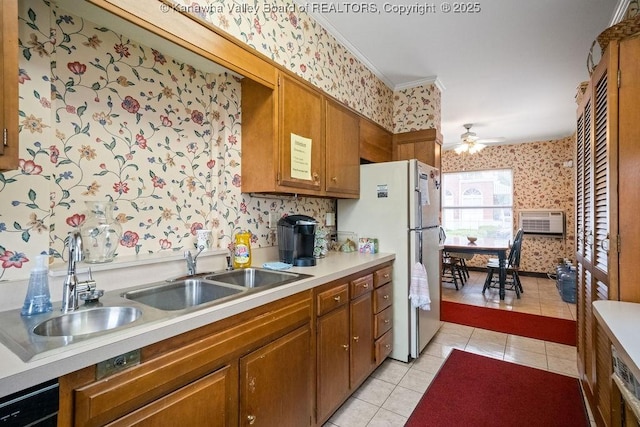 1598 Kanawha Blvd E, Charleston, WV 25311 - kitchen with wallpapered walls, light tile patterned flooring, freestanding refrigerator, a ceiling fan, and brown cabinets