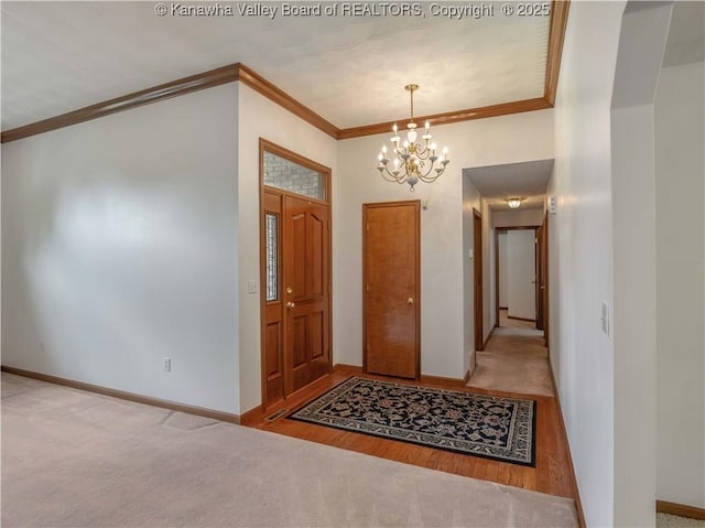 3710 Cambridge Cir, Hurricane, WV 25526 - entryway with crown molding, a chandelier, carpet floors, and wood finished floors