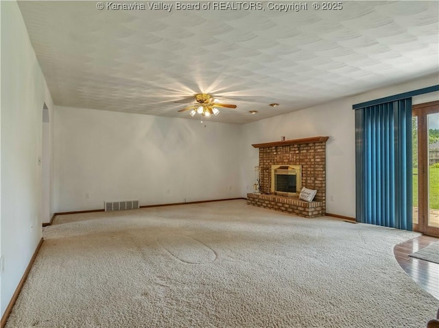 3710 Cambridge Cir, Hurricane, WV 25526 - unfurnished living room with a ceiling fan, a brick fireplace, and carpet flooring