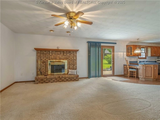 3710 Cambridge Cir, Hurricane, WV 25526 - unfurnished living room featuring carpet flooring, ceiling fan, and a fireplace