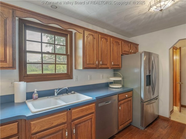 3710 Cambridge Cir, Hurricane, WV 25526 - kitchen featuring appliances with stainless steel finishes, brown cabinetry, and dark wood-style flooring