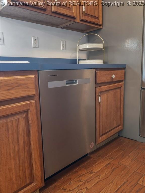3710 Cambridge Cir, Hurricane, WV 25526 - kitchen featuring stainless steel dishwasher, brown cabinets, dark wood-style floors, and dark countertops