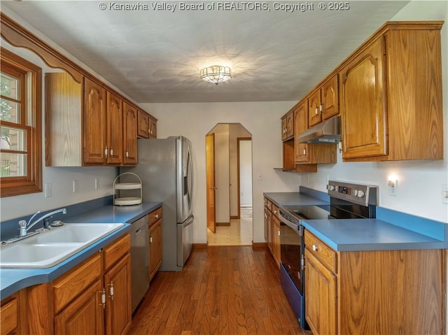 3710 Cambridge Cir, Hurricane, WV 25526 - kitchen with range with electric cooktop, under cabinet range hood, dishwasher, and brown cabinets