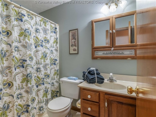 3710 Cambridge Cir, Hurricane, WV 25526 - bathroom featuring vanity, a shower with shower curtain, and a textured ceiling