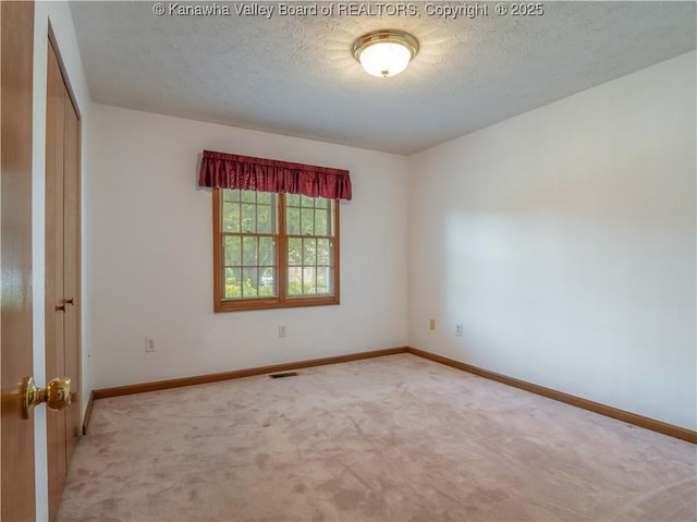 3710 Cambridge Cir, Hurricane, WV 25526 - carpeted empty room featuring baseboards and a textured ceiling